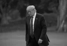 Somber looking Trump, walking head down