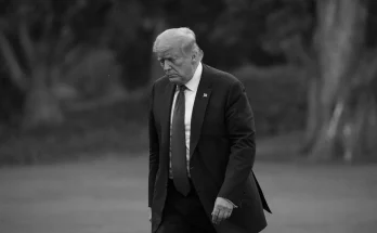 Somber looking Trump, walking head down